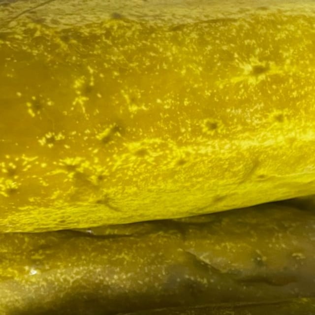 Big, large dill pickle.