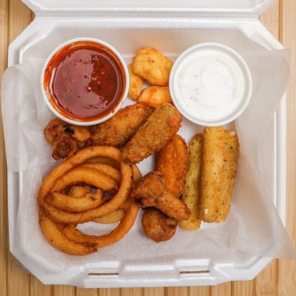 A Lee's Deli fried appetizer platter with onion rings, mozzarella sticks, fried pickles, and dipping sauces.