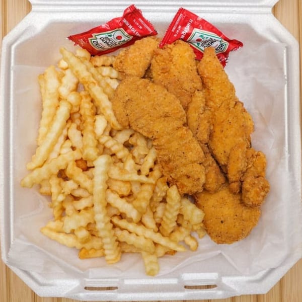 Lee's Deli chicken tenders and crinkle-cut fries with two ketchup packets in a white takeout container.